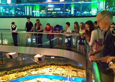 Center Director Michael Mortimer (above, far right) and students observe a large-scale model of urbanization in Shanghai. Executive Master of Natural Resources students visited this rapidly developing city (L) as part of the program’s international residency.