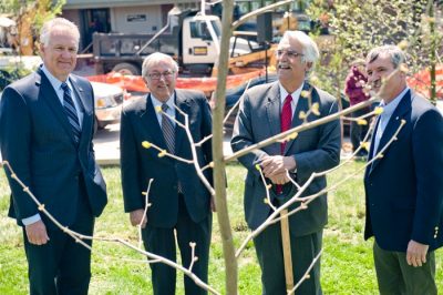 Dean Paul Winistorfer, President Charles W. Steger, Blacksburg Mayor Ron Rordam, and Professor John Seiler admire the recently planted tree.
