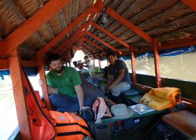 Aaron Teets and local assistants travel up the Yarapa River, a tributary of the Amazon.