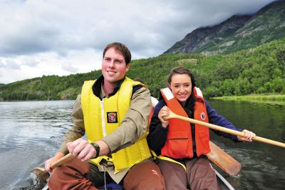 Clark (left) and a fellow “Aqua Kids” cast member canoe on Jim Lake in Alaska, learning about anadromous fish.