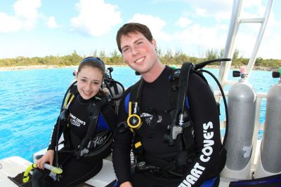 Clark (right) and a fellow “Aqua Kids” cast member prepare for SCUBA diving with sharks with Stuart Cove’s Dive Bahamas.
