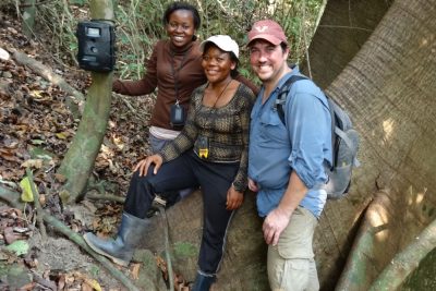 Three people in a Cameroonian jungle.