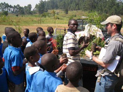 Students receiving trees to plant.