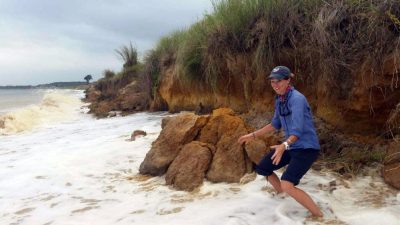 On Cedar Island, Virginia: The boulder to Alex Crooks' right had towered over her only hours earlier. By the next morning, it had washed completely away.