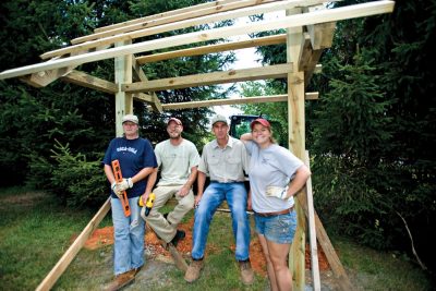 (L-R) FRRC employees Debbie Bird, Kyle Peer, Clay Sawyers, and former student Erin Eberstein built a kiosk at the start of the LEAF trail, which is now used by hundreds of visitors, students, and hikers each year.
