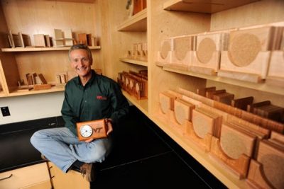 Professor Earl Kline, shown with some past Wood Enterprise Institute products, initiated the WEI in 2007.
