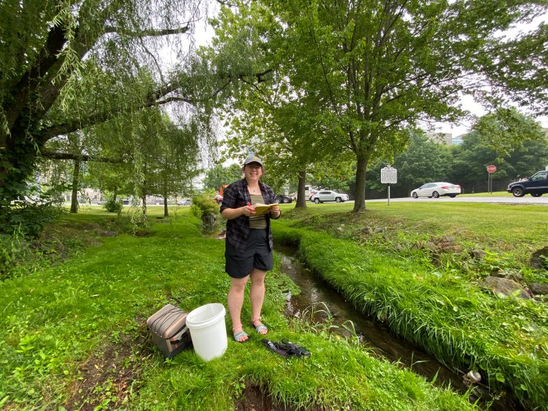 The photo shows Cleo Orlando by Stroubles stream near the Duck Pond on the campus of Virginia Tech.